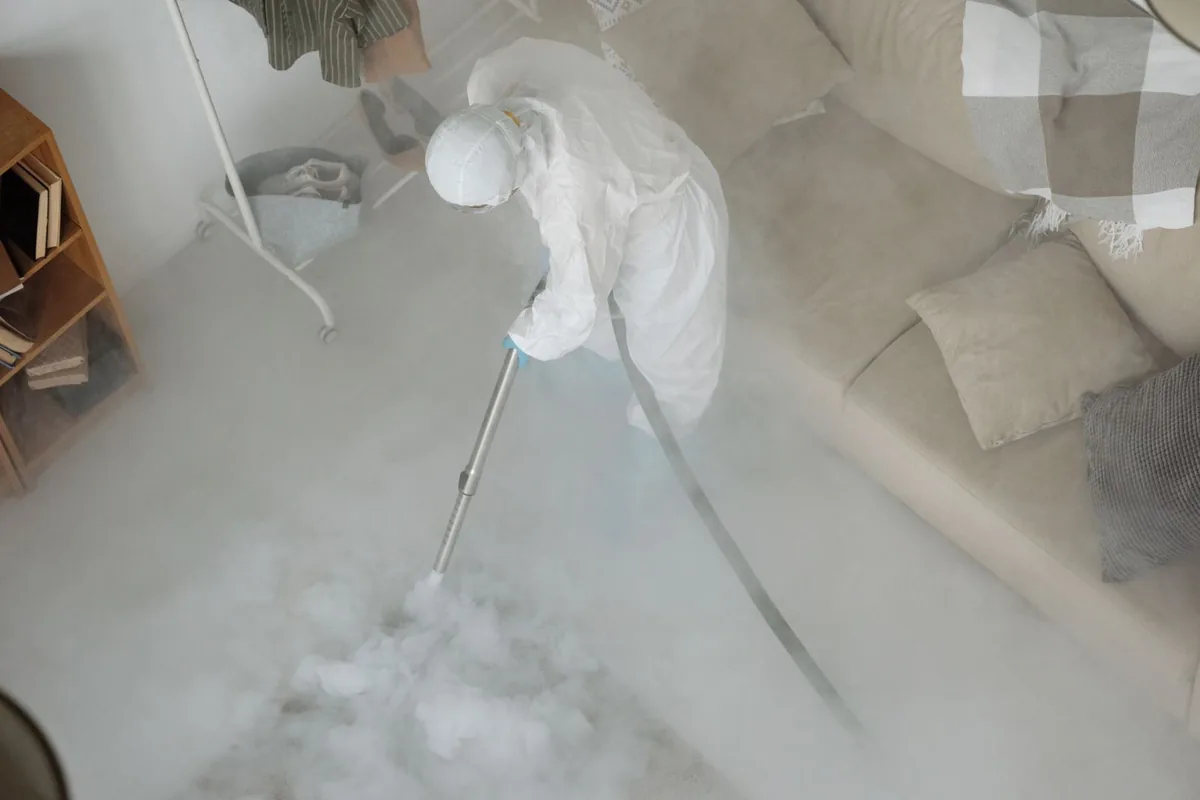 Biohazard cleanup technician in protective equipment, Mount Clemens, MI